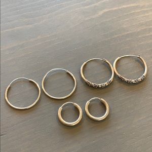 Set of 3 sterling silver hoop earrings. Brand new.